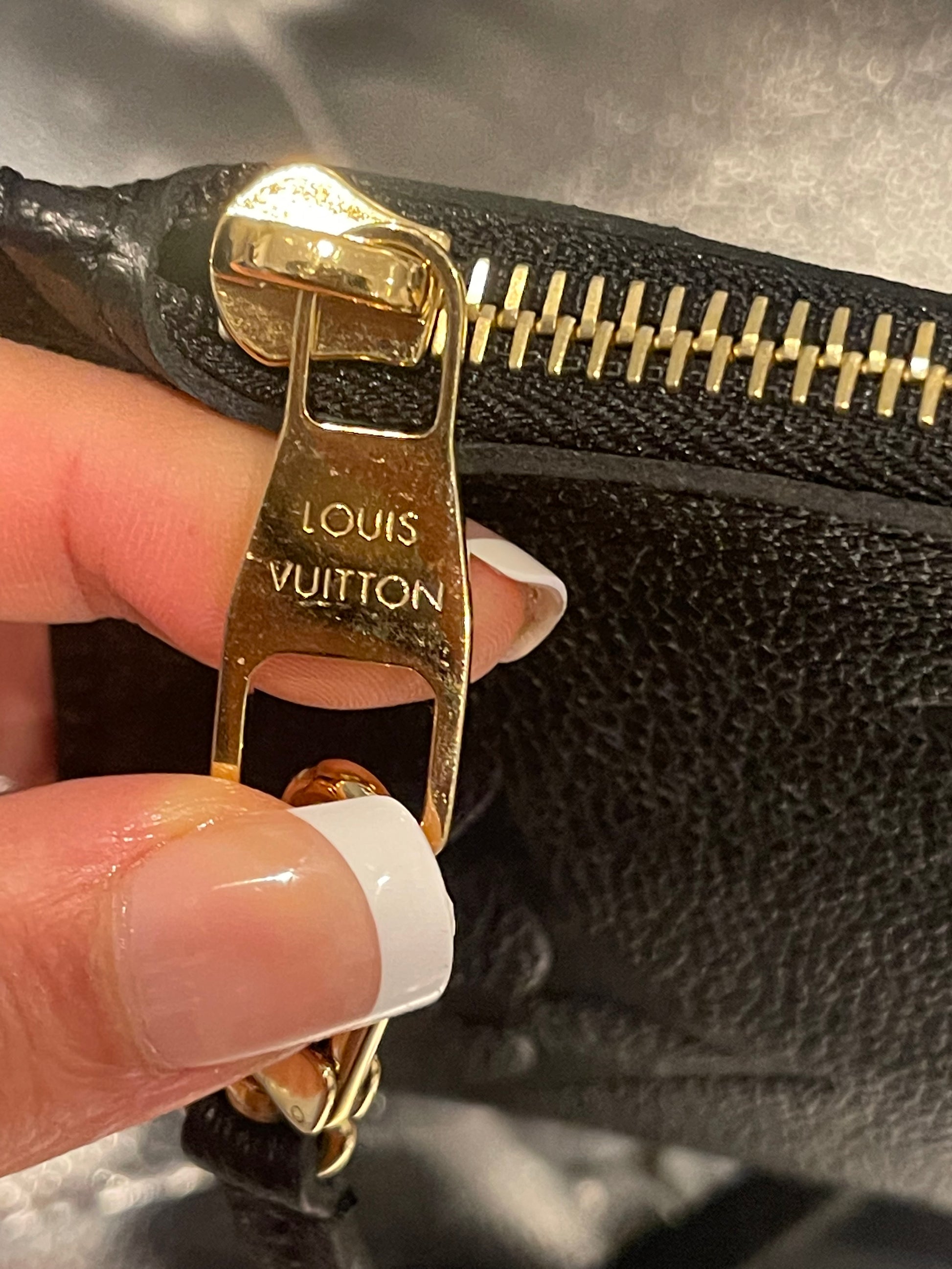 Louis Vuitton Empreinte Neverfull Pouch Black – Vegaluxuries